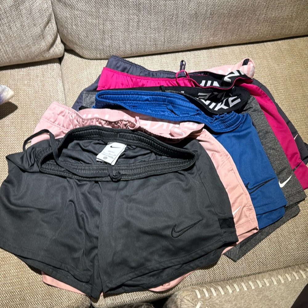 Lot of Nike dri fit shorts used for soccer one season.